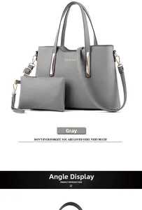 Dettaglio della borsa tote grigia con trama litchi e piccola pochette con zip coordinata
