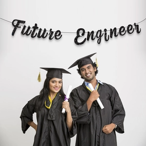 Future Engineer black glitter graduation banner held by graduates in academic gowns