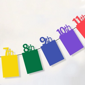 Close-up of colorful graduation photo banner frames with cutout numbers on white background