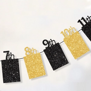 Detail of black and gold glitter party banner featuring numbers 7th to 11th on white background