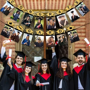 Glittery gold Congrats Grad banner with graduation cap photo clips for school party decor