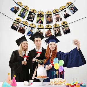Congrats Grad glitter photo banner with party supplies for graduation celebrations