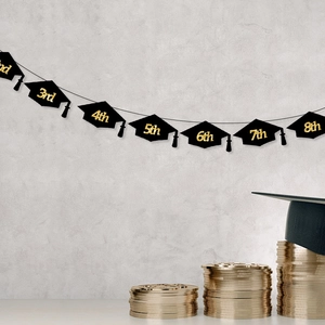 Graduation banner with black doctoral caps and golden glitter numbers for party decor