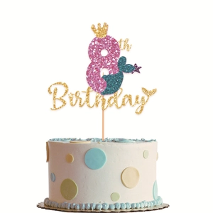 Close-up of glittery 8th birthday mermaid cake topper with pink and blue mermaid tail design