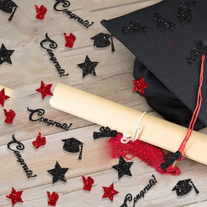 Graduation party confetti with black and red glitter star shapes and bachelor hats