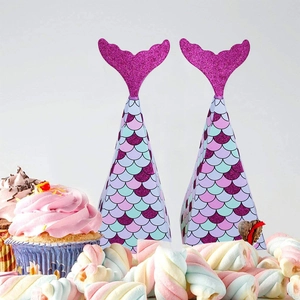 Detail of mermaid tail party gift boxes with purple sequins and colorful scale patterns