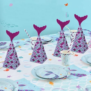 Mermaid tail gift box set with purple scales on a decorated ocean party table