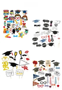 Detailed close-up of 2025 graduation party photo booth props with paper and wooden sticks