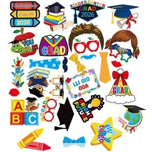 Kindergarten Grad 2026 photo prop set with vibrant paper hats, books, and colorful diploma cards
