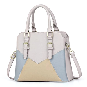 Three-color patchwork faux leather tote bag with top handles and gold buckle accents