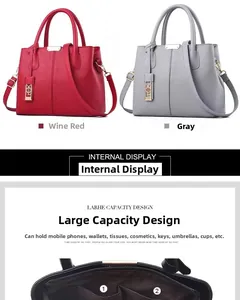 Detail view of wine red and grey leather handbags with multi-compartment interior storage