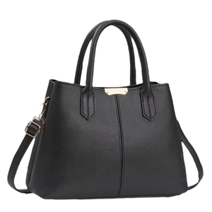 Elegant black faux leather tote bag with double handles and adjustable crossbody strap