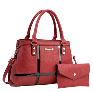 Red pebbled leather large tote bag with matching envelope pouch and gold hardware