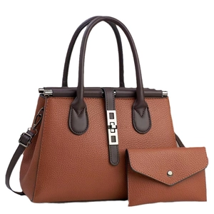 Brown two-piece leather handbag set featuring a medium tote and matching envelope wallet