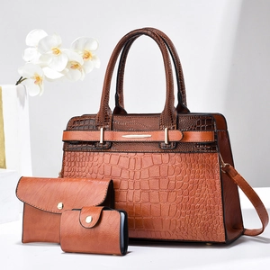 Detail view of 3-piece dark brown faux crocodile leather tote handbag set with gold hardware