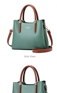 Détails du sac à main en cuir vert foncé avec garnitures dorées et anses rondes brunes