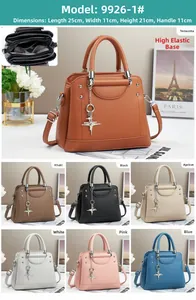 Detail view of large capacity crossbody handbag with star pendant and inner compartments