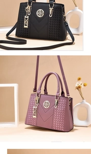 Detail of lychee textured leather tote bags with V-shaped stitching and gold logo
