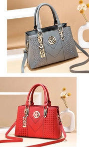 Detail view of stylish lychee-patterned tote bags in grey and red with V-shaped stitching