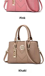 Detail view of pink and khaki PU leather handbags with metallic circular brand tags