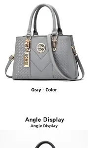 Detail view of gray women's handbag featuring premium litchi grain texture and V-shaped accents