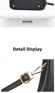 Detail of black litchi texture leather handbag with golden metal base studs and strap hooks