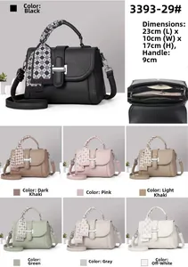 Detailed view of fashionable square bag featuring lychee texture and silk-wrapped handle