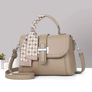 Khaki pebbled leather square bag with decorative silk scarf handle and silver metal clasp