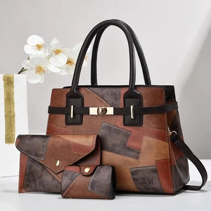 Detailed macro view of the three-piece handbag set with gold locks and patchwork design