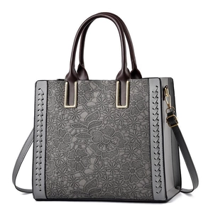 Grey lace-embossed leather tote bag for women with brown straps and gold hardware