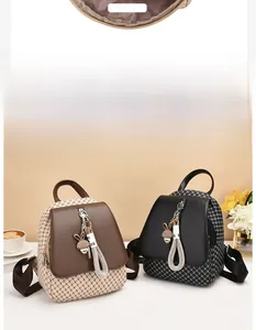 Macro view showing the front pocket structure and dual-tone woven texture of the mini backpack