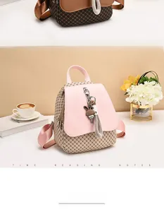 Detail view of mini PU leather backpacks with diamond quilted texture and bunny charm