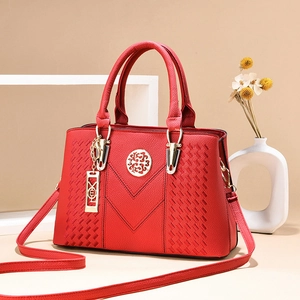 Elegant red litchi leather handbag with golden V-stitching and adjustable strap