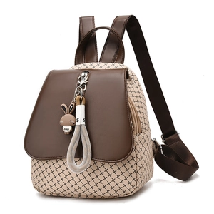 Women's cute mini backpack with beige cross pattern, brown leather trim and bunny charm