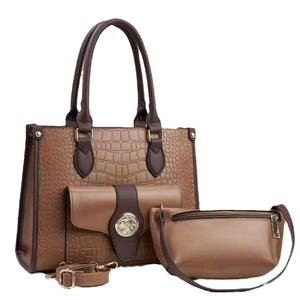 Three-piece set of brown faux crocodile leather tote bags with vintage gold hardware details
