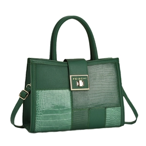 Dark green patchwork tote bag with crocodile pattern and golden metal twist lock