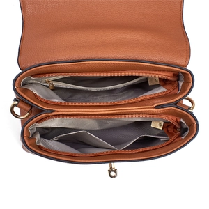 Interior view of brown leather handbag with multiple zipper compartments and gray lining