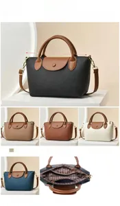 Detailed dimensions of the leather crossbody bag featuring a classic fold-over flap design