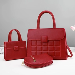 Three-piece red tote bag set with quilted texture and gold hardware detailing