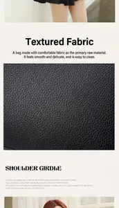 Detail van zwarte lederen handtas met litchi-textuur en verstelbare schouderbanden