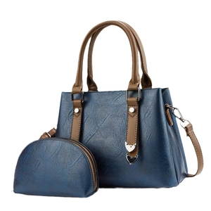 Ensemble sac à main bleu foncé texture crocodile avec lanières brunes et bourse