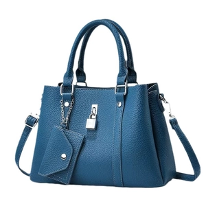 Dark blue pebbled leather tote bag with silver padlock and small triangle coin pouch