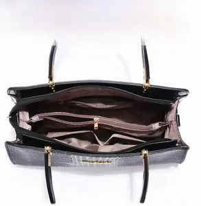 Internal view of black crocodile pattern tote bag with large capacity and zip pockets