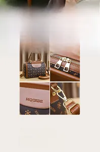 Detail of Boston bag showing MQCKDE logo embossing, dual zippers and metal strap hooks