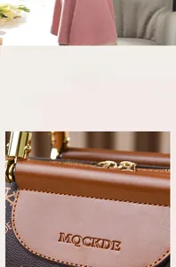 Detail of premium golden hardware and embossed brand logo on brown Boston bag
