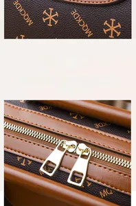Detail of high-quality golden double zippers on a printed brown Boston bag for women