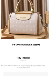 Close-up of cream white Boston bag featuring golden accents and MQCKDE logo texture