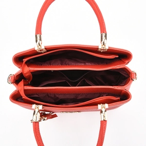 Red tote bag with three compartments, gold hardware and pebble grain texture