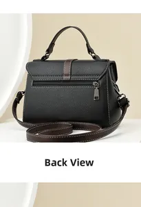 Back view of black pebbled leather crossbody bag with brown straps and white stitching
