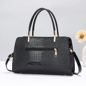 Minimalist black crocodile embossed tote bag with gold hardware and dual handles